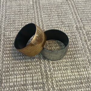 Premier Designs Bracelets. Set of 2. One Silver, One Gold made of hard plastic.